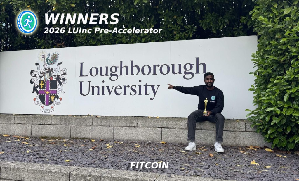 Vithuran Skandarajaah holding the winners' trophy by the Loughborough University sign, named winners of the 2026 LUInc Pre-Accelerator